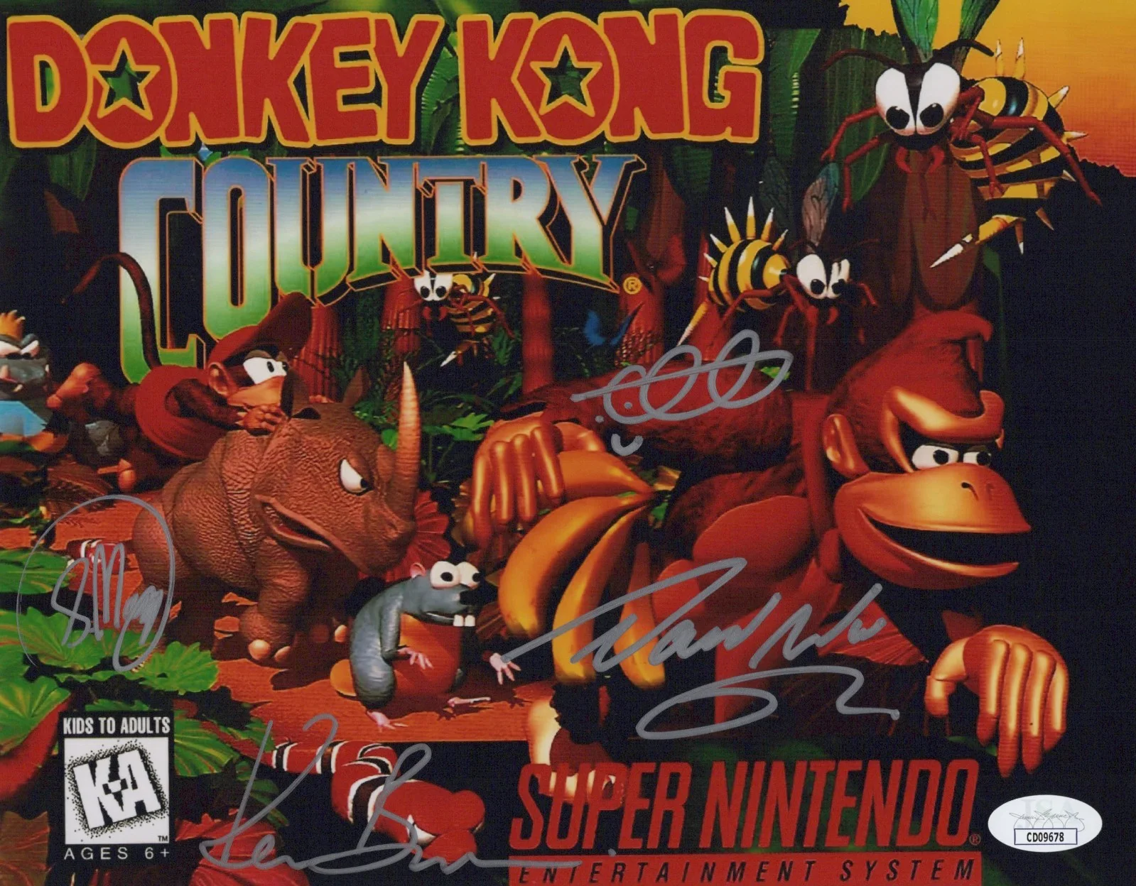 David Wise, Kevin Bayliss, Chris Sutherland & Steve Mayles — Chris Sutherland David Wise +2 Signed 8x10 Donkey Kong Country Photo JSA COA