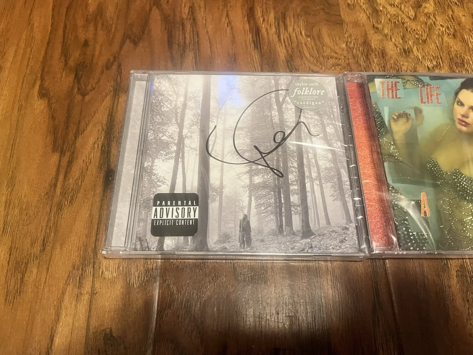 TAYLOR SWIFT SIGNED FOLKLORE CD AND SIGNED THE LIFE OF A SHOWGIRL CD, image 2