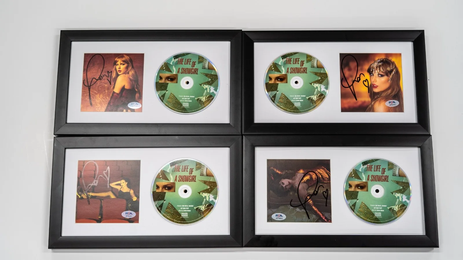 Taylor Swift — Taylor Swift Signed CD Cover Bundle Framed PSA/DNA The Life of a Showgirl