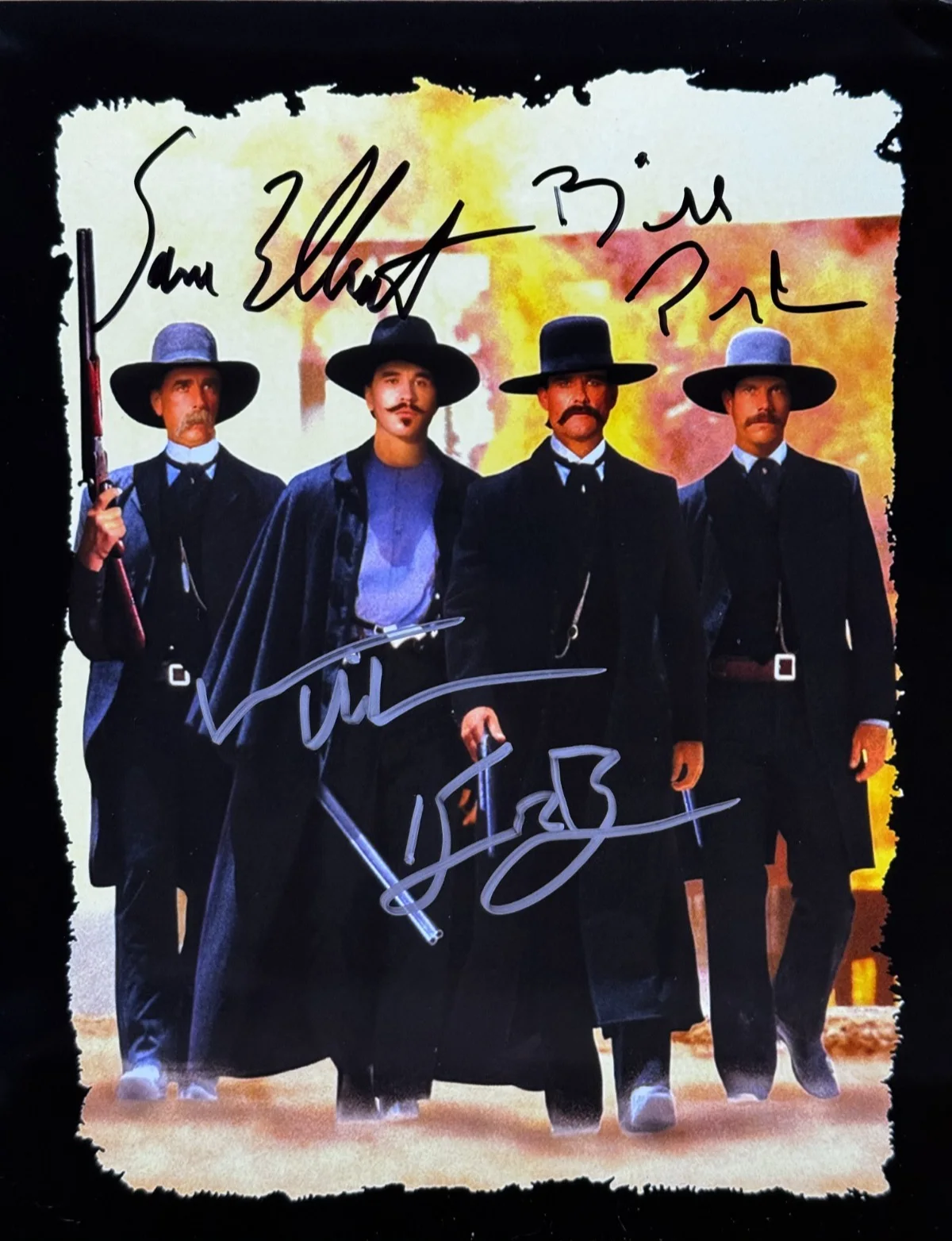 Val Kilmer, Kurt Russell, Bill Paxton, Sam Elliott — Tombstone Cast signed by Kilmer, Elliott, Paxton, Russell 8x10 Autograph + COA