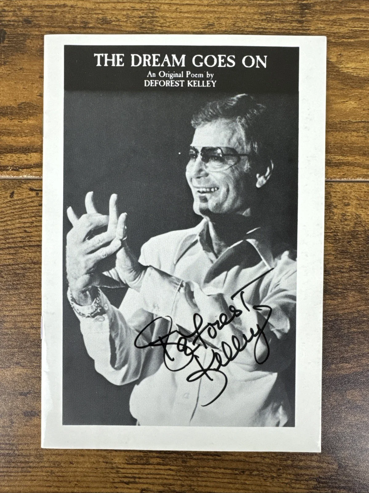 DeForest Kelley — "The Dream Goes On" written and autographed by DeForest Kelley