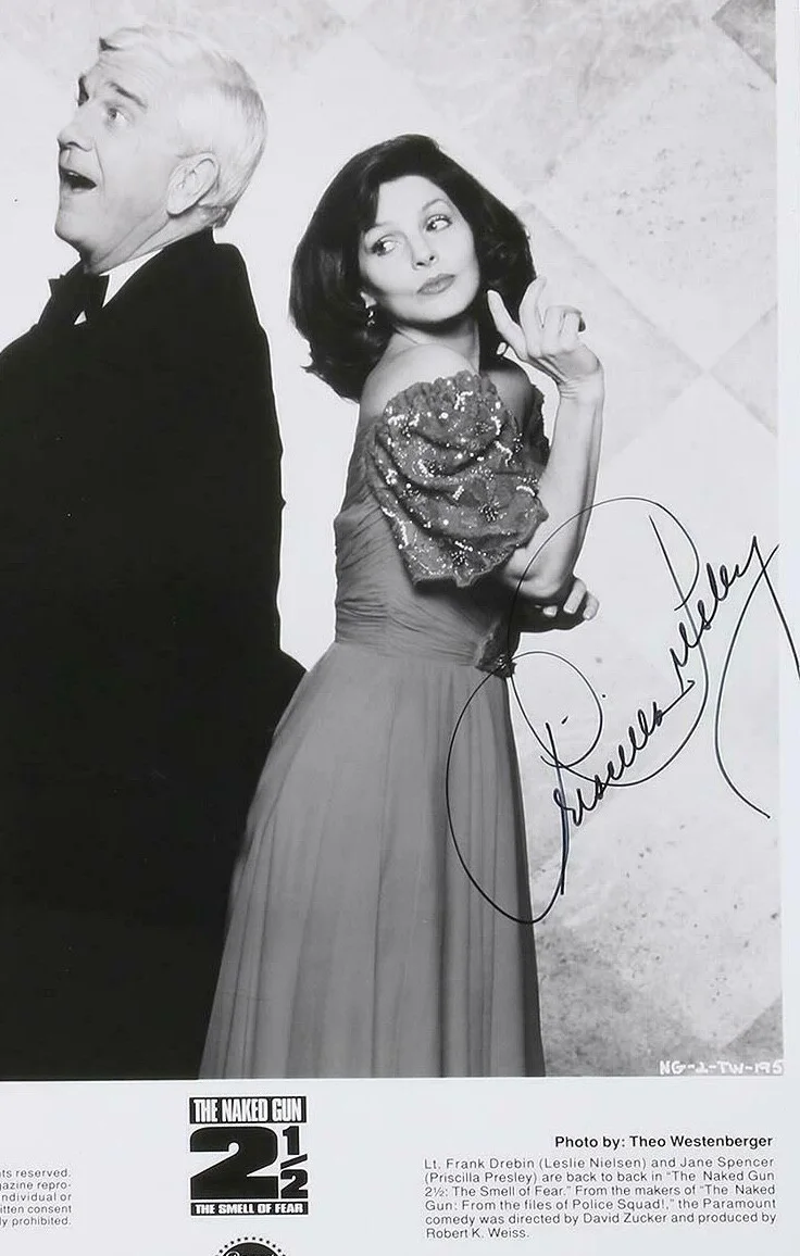Priscilla Presley — Priscilla Presley& Leslie Nielsen Publicity 2 1/2 Naked Gun signed by Priscilla