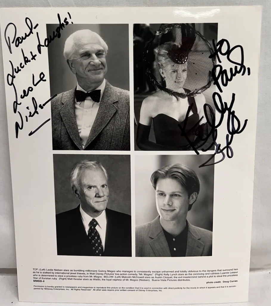 Leslie Nielsen & Kelly Lynch — Leslie Nielsen & Kelly Lynch in Mr Magoo Signed B/W 8x10 Picture Personalized
