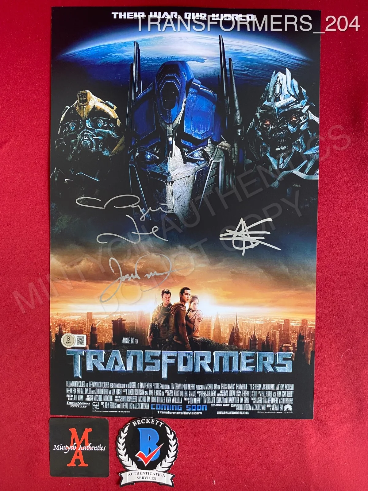 Megan Fox, Shia LaBeouf, Josh Duhamel — Transformers cast signed 11x17 photo Megan Fox Shia LaBeouf Josh Duhamel Beckett