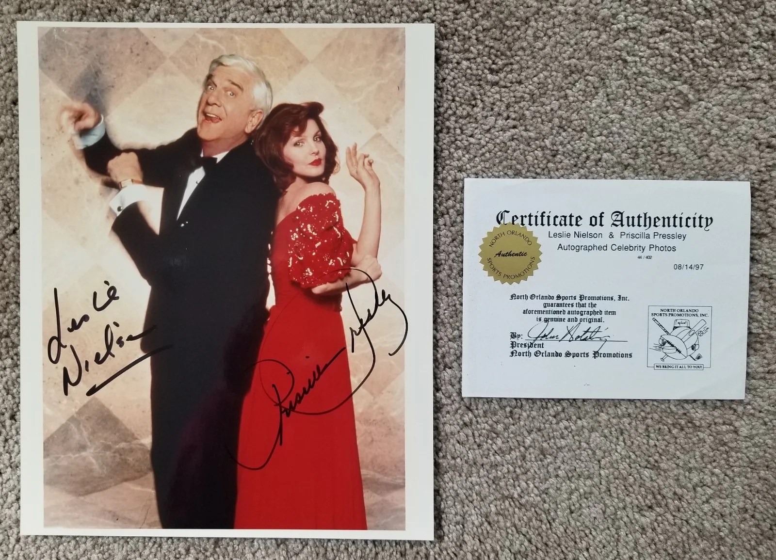 Priscilla Presley AND Leslie Nielsen — Priscilla Presley & Leslie Nielsen - Naked Gun - SIGNED BY BOTH - Has COA