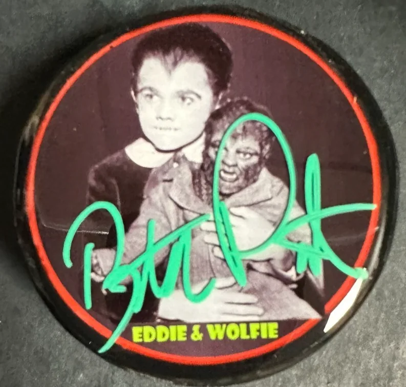 Butch Patrick — Butch Patrick Eddie Munster Autographed Photo Hockey Puck The Munster's