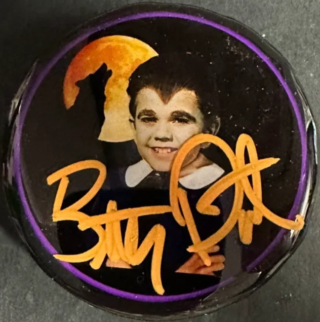 Butch Patrick — Butch Patrick Eddie Munster Autographed Photo Hockey Puck The Munster's