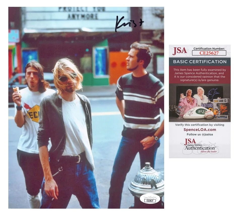 KRIST NOVOSELIC — Krist Novoselic signed "NIRVANA" 8x10 Photo a Kurt Cobain, Dave Grohl JSA COA