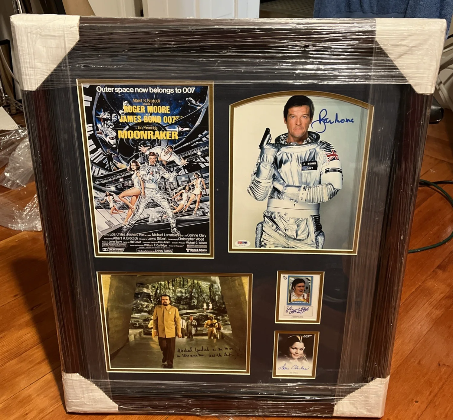 Roger Moore — Roger Moore Autograph Moonraker Collage Framed 26 X 23 PSA & JSA