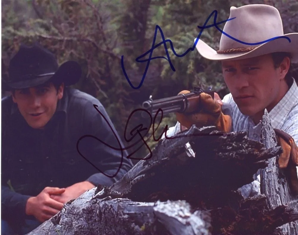 Cast — BROKEBACK MOUNTAIN (2) 8x10 photos signed by HEATH LEDGER and JAKE GYLLENHAAL