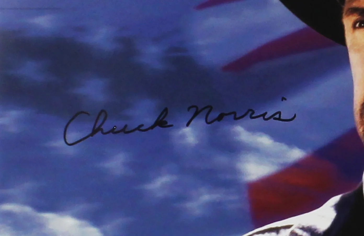 Chuck Norris — Chuck Norris Signed Unframed 11x14 Close up Photo with American Flag Background, image 2