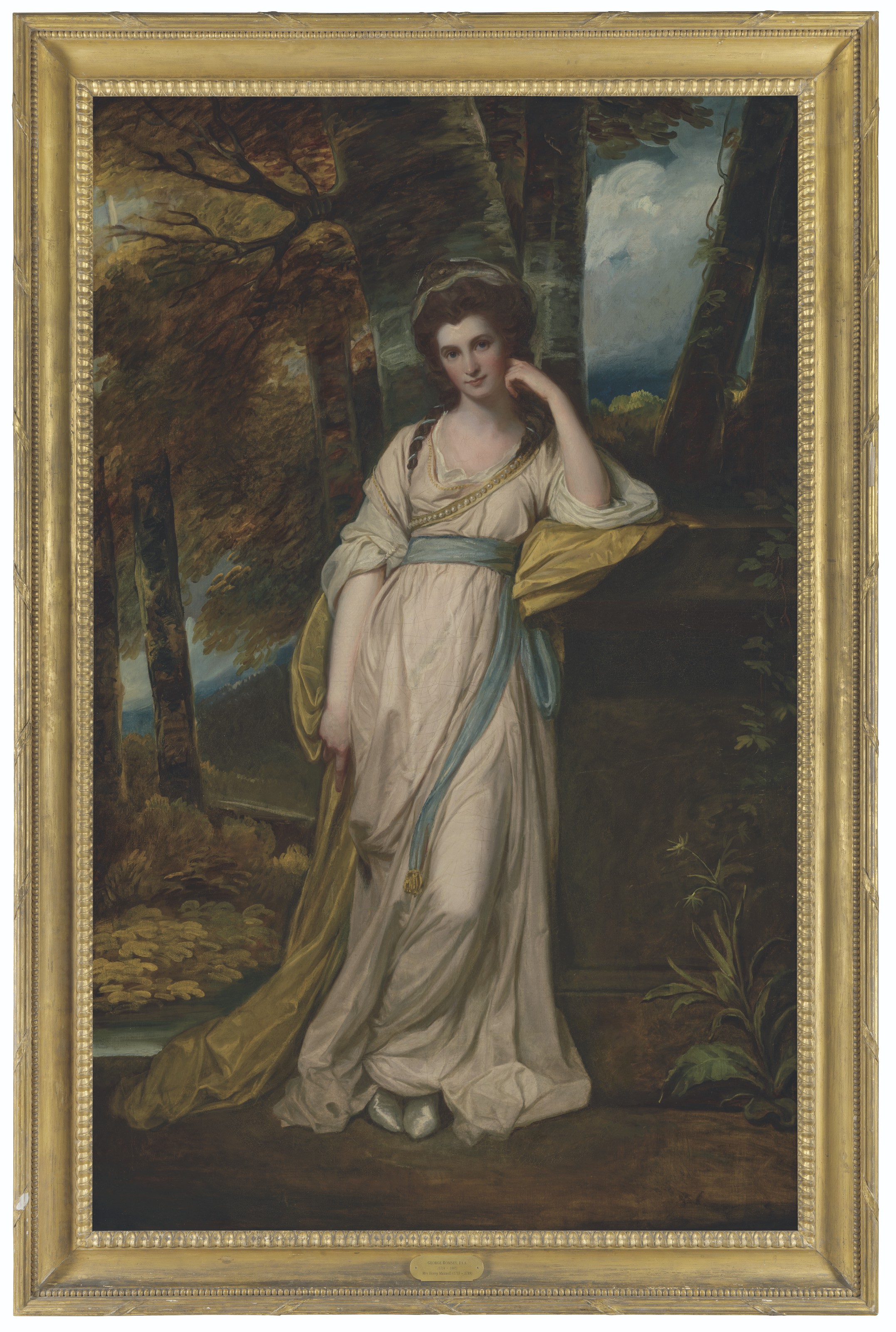 George Romney — Портрет миссис Деборы Джемаймы Максвелл (1755-1789) в полный рост, в бледно-розовом платье с голубым поясом и желтой накидке, на фоне лесистого пейзажа, изображение 2