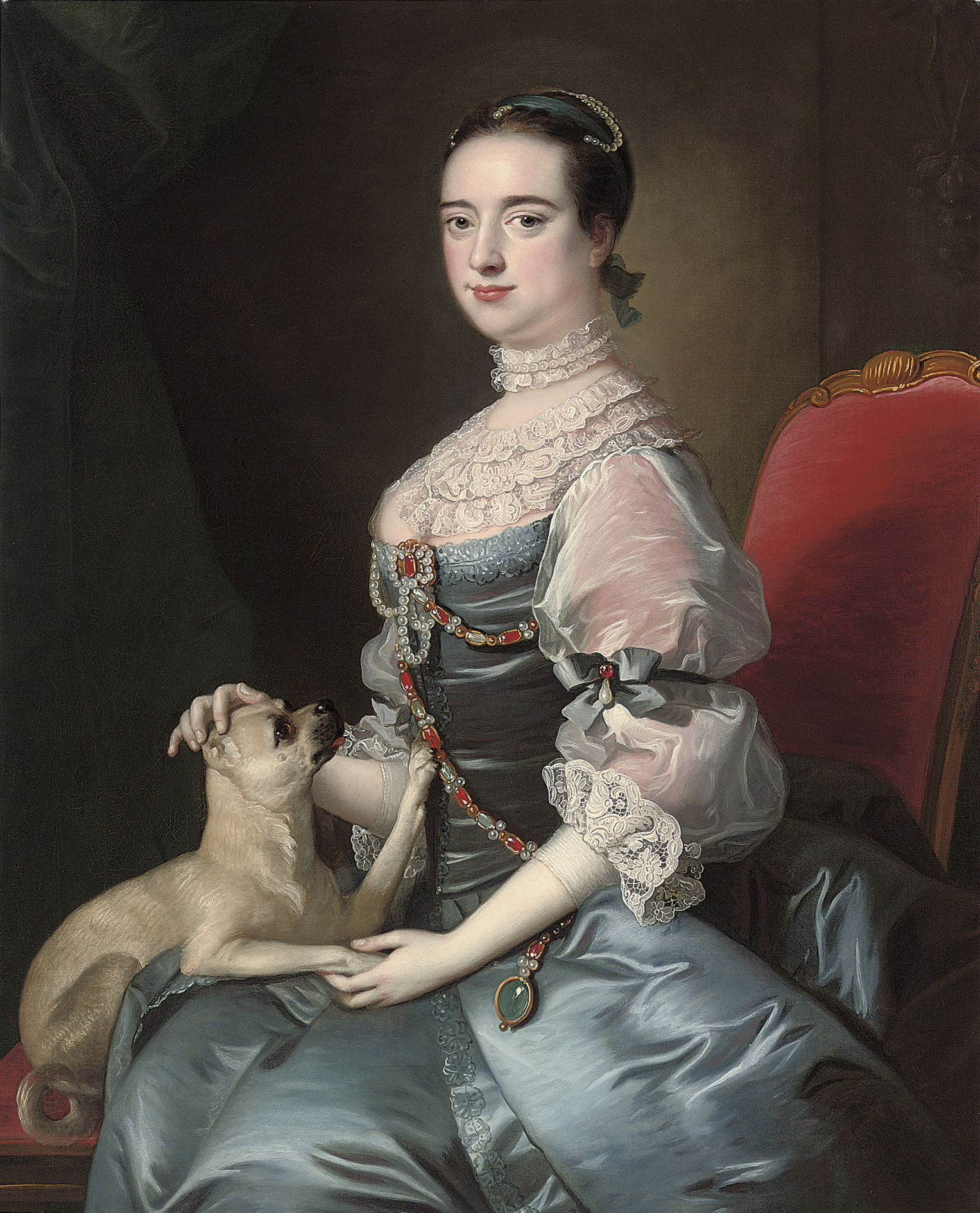 Joseph Wright Of Derby — Портрет дамы в три четверти роста, сидящей в голубом атласном платье с кружевными рукавами и воротником, украшенном драгоценными камнями, с собачкой мопс