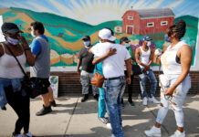 Protesters gather at the scene where Floyd was pinned down by a police officer in Minneapolis