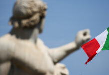The Italian flag waves over the Quirinal Palace in Rome