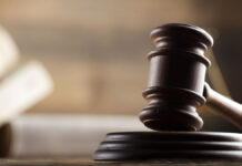 LawThemeMalletOfTheJudgeWoodenDeskScalesOf