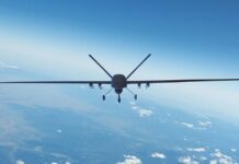 AirForceUnmannedAerialVehicleWithMilitaryEquipmentFlyingNear