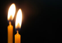 Герой СВО Александр Федосеев из Пермского края погиб после марша в Москве Two,Candles,On,A,Black,Background