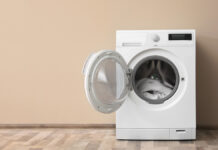 Modern,Washing,Machine,With,Laundry,Near,Color,Wall,,Space,For