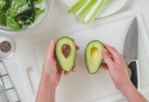 Halves,Of,The,Avocado,In,The,Woman’s,Hands.green,Salad,Recipe,
