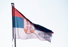 Три женщины-депутата ранены в кровавом хаосе сербского парламента The,Flag,Of,The,Republic,Of,Serbia,Flutters,In,The