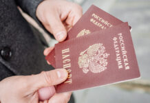ФССП России объявила о снятии ограничений на выезд для должников Two,Russian,Passports,In,Hand.,Russian,Official,Document,On,Outdoor