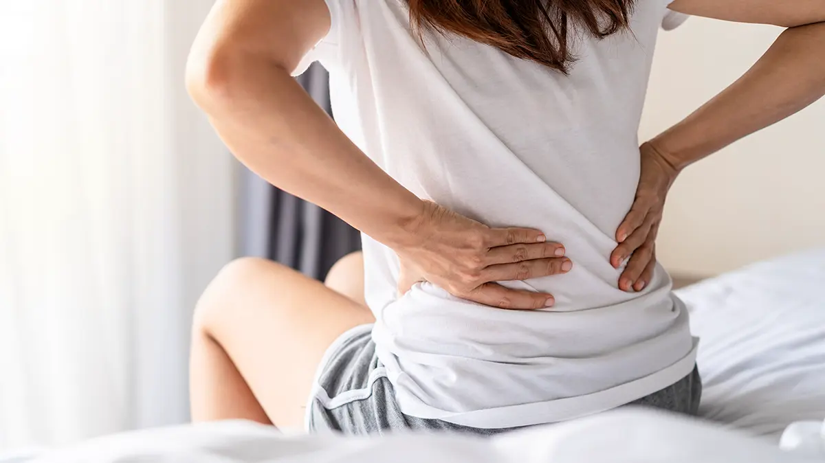 Почему болит спина
