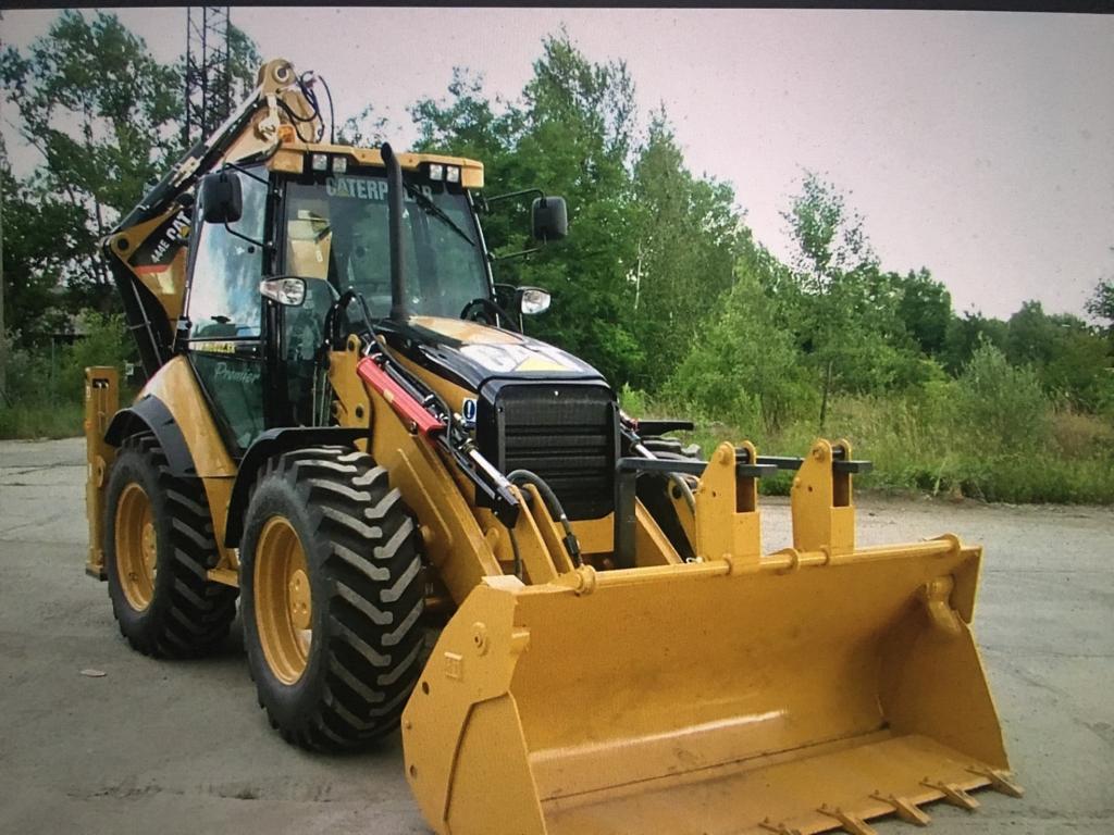 Аренда экскаватора-погрузчика Cat, услуги заказ
