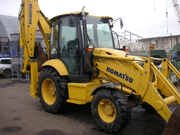 Слуги экскаватора-погрузчика KOMATSU