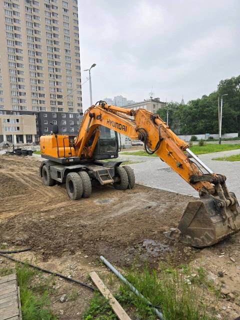 Услуги колесного экскаватора 14 тонн