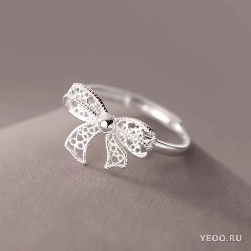 Кольцо из серебра с ажурным бантом, разомкнутое, женское, свежий стиль